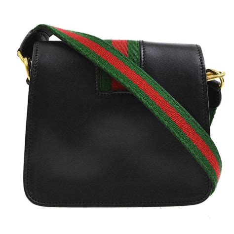 Gucci crossbody with striped strap